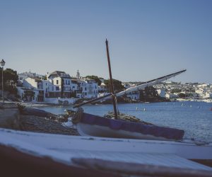 a small boat in a bay of a Mediterranean town-1030553